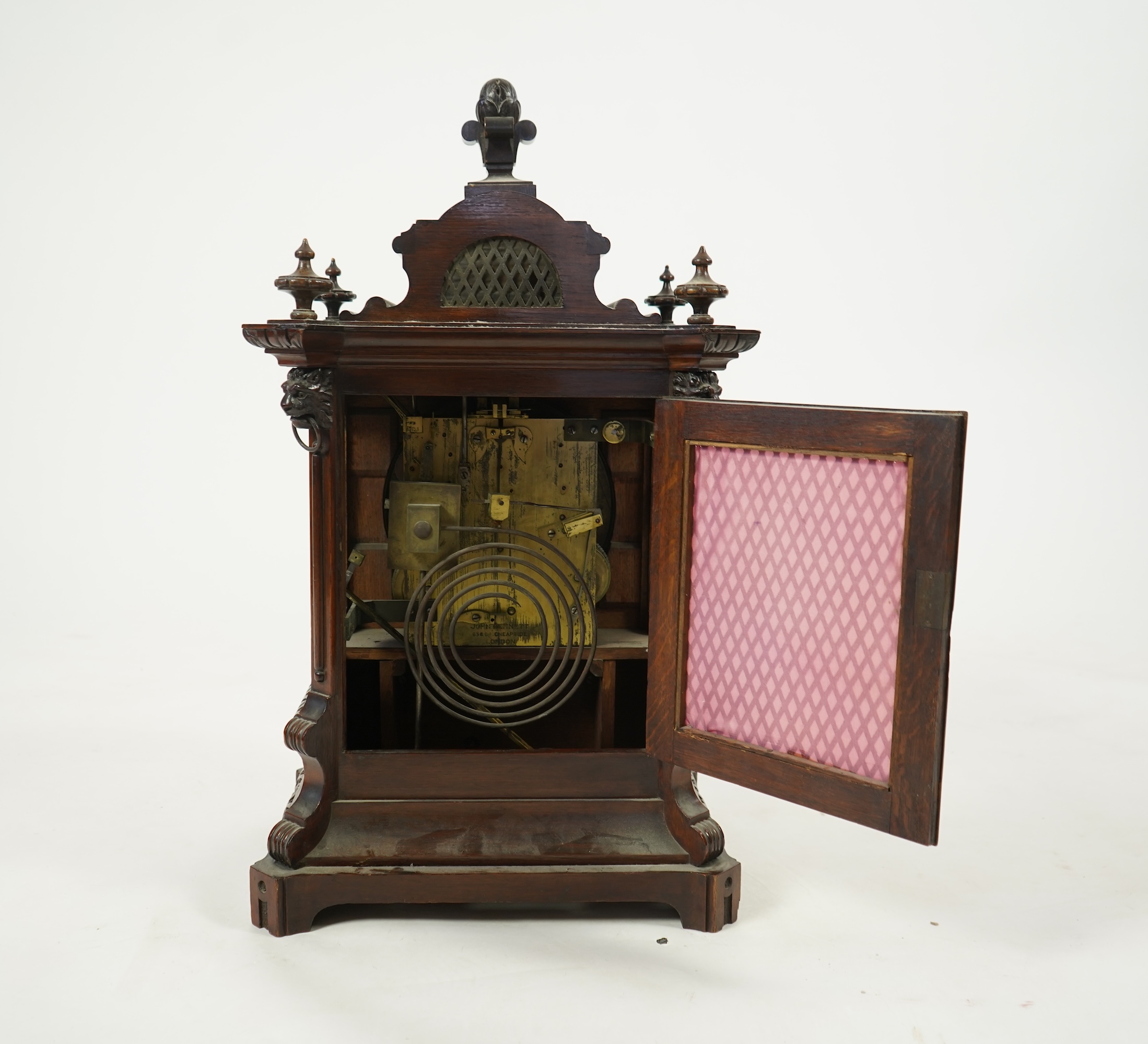 A late 19th century carved oak triple fusee bracket clock
